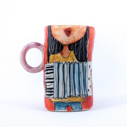 girl playing accordion painted on ceramic cup