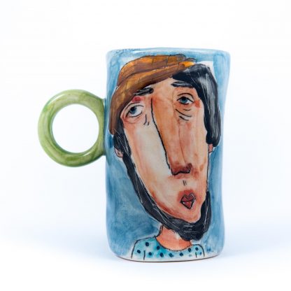 handpainted man portrait on ceramic cup