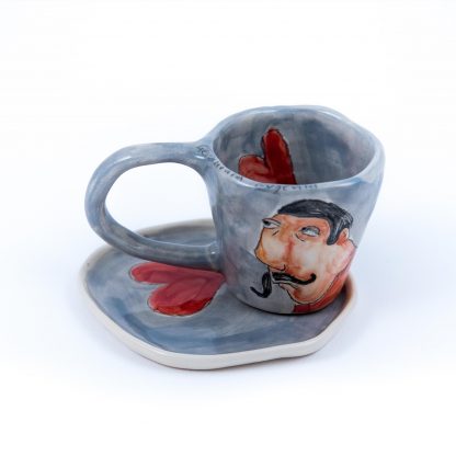 man portrait ceramic art on espresso cup