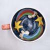 XL handmade ceramic cup with hand painted cartoon named Miss Art and colorful painting inside.