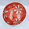 Handmade ceramic salad bowl with hand painted cartoon named Miss Art and colorful floral painting inside.