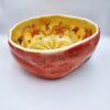 Handmade ceramic salad bowl with hand painted cartoon named Miss Art and colorful painting inside.
