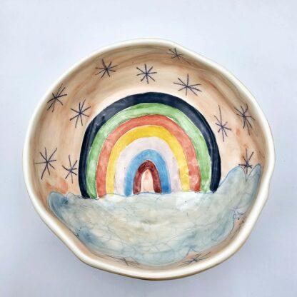Rainbow handmade ceramic salad bowl with hand painted cartoon named Miss Art and colorful painting inside.