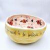 Handmade ceramic salad bowl with hand painted cartoon named Miss Art and colorful painting inside.