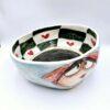 Handmade ceramic salad bowl with hand painted cartoon named Miss Art and colorful painting inside.