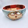 Handmade ceramic salad bowl with hand painted cartoon named Miss Art and colorful painting inside.
