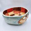 Handmade ceramic salad bowl with hand painted cartoon named Miss Art and colorful painting inside.