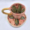 Floral ceramic espresso cup with handle and saucer