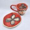 Cute pottery espresso cup with handle and saucer