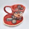 Cute pottery espresso cup with handle and saucer