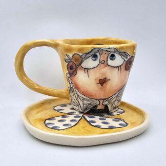 Cute pottery espresso cup with handle and saucer