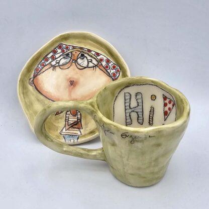 Unique stoneware espresso cup with handle and saucer