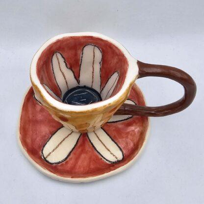 Floral stoneware espresso cup with handle and saucer