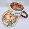 Unique pottery tea cup with handle and saucer