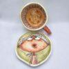 Unique stoneware tea cup with handle and saucer