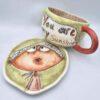Unique stoneware tea cup with handle and saucer
