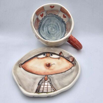 Unique stoneware tea cup with handle and saucer