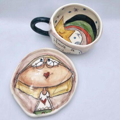 Cute stoneware tea cup with handle and plate
