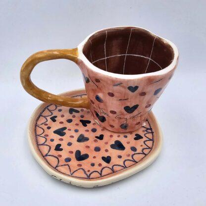 Stoneware espresso cup with handle and saucer