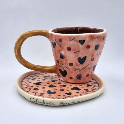 Stoneware espresso cup with handle and saucer