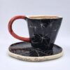 Stoneware espresso cup with handle and saucer