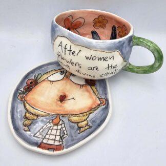 Ceramic tea cup with handle and saucer