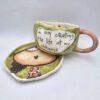 Pottery tea cup with handle and saucer