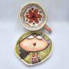 Pottery tea cup with handle and saucer