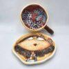 Stoneware tea cup with handle and saucer