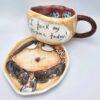 Stoneware tea cup with handle and saucer