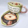 Cute stoneware tea cup with handle and saucer