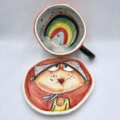 Cute stoneware tea cup with handle and saucer