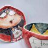 Handmade and hand painted stoneware tea cup