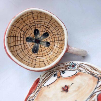 Handmade and hand painted stoneware tea cup