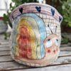 Unique pottery cup shaped as a gunny / burlap sack